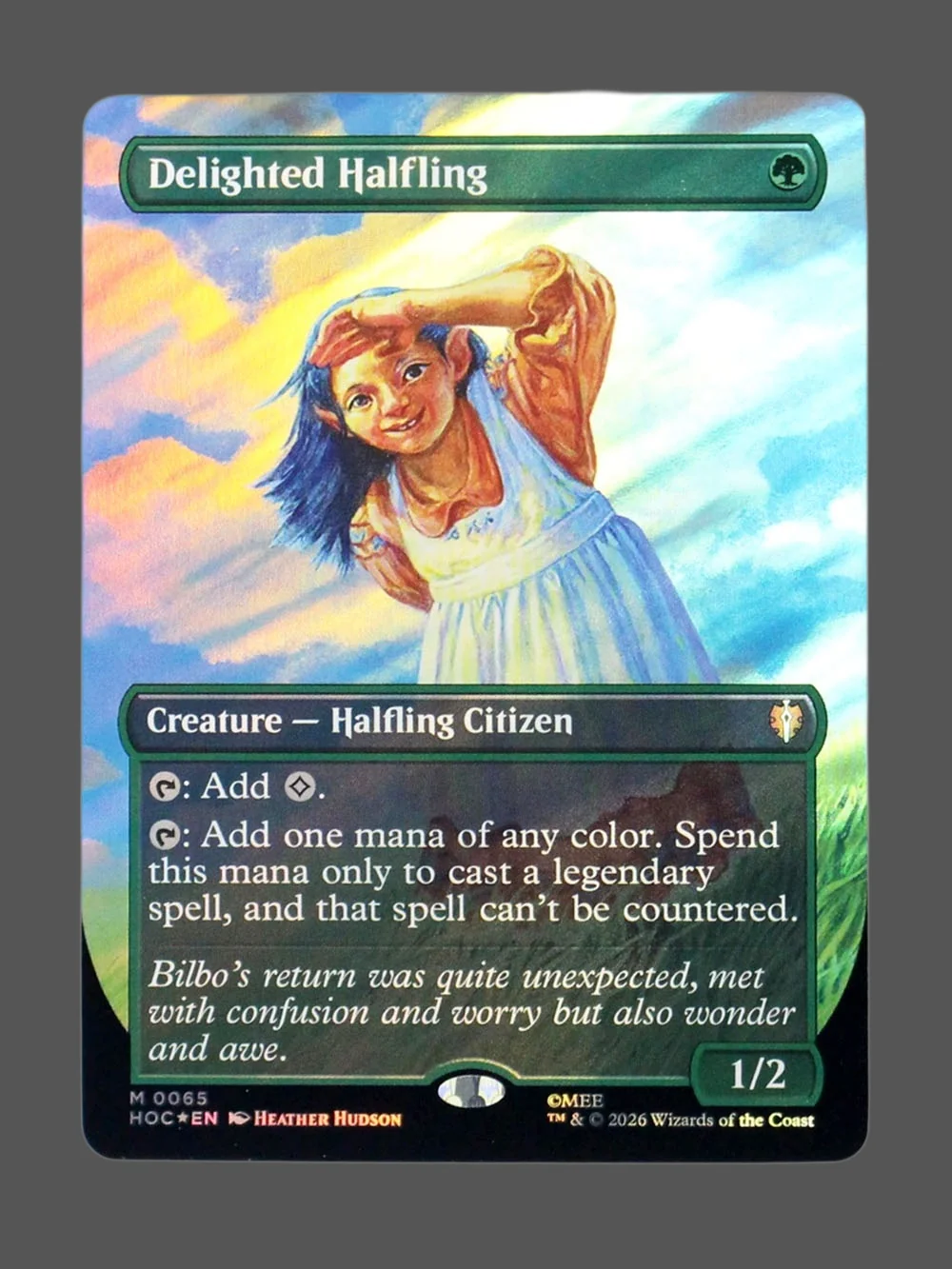 delighted-halfling-65-surgefoil.webp Delighted Halfling Surge Foil MTG proxy card from The Hobbit Eternal #65