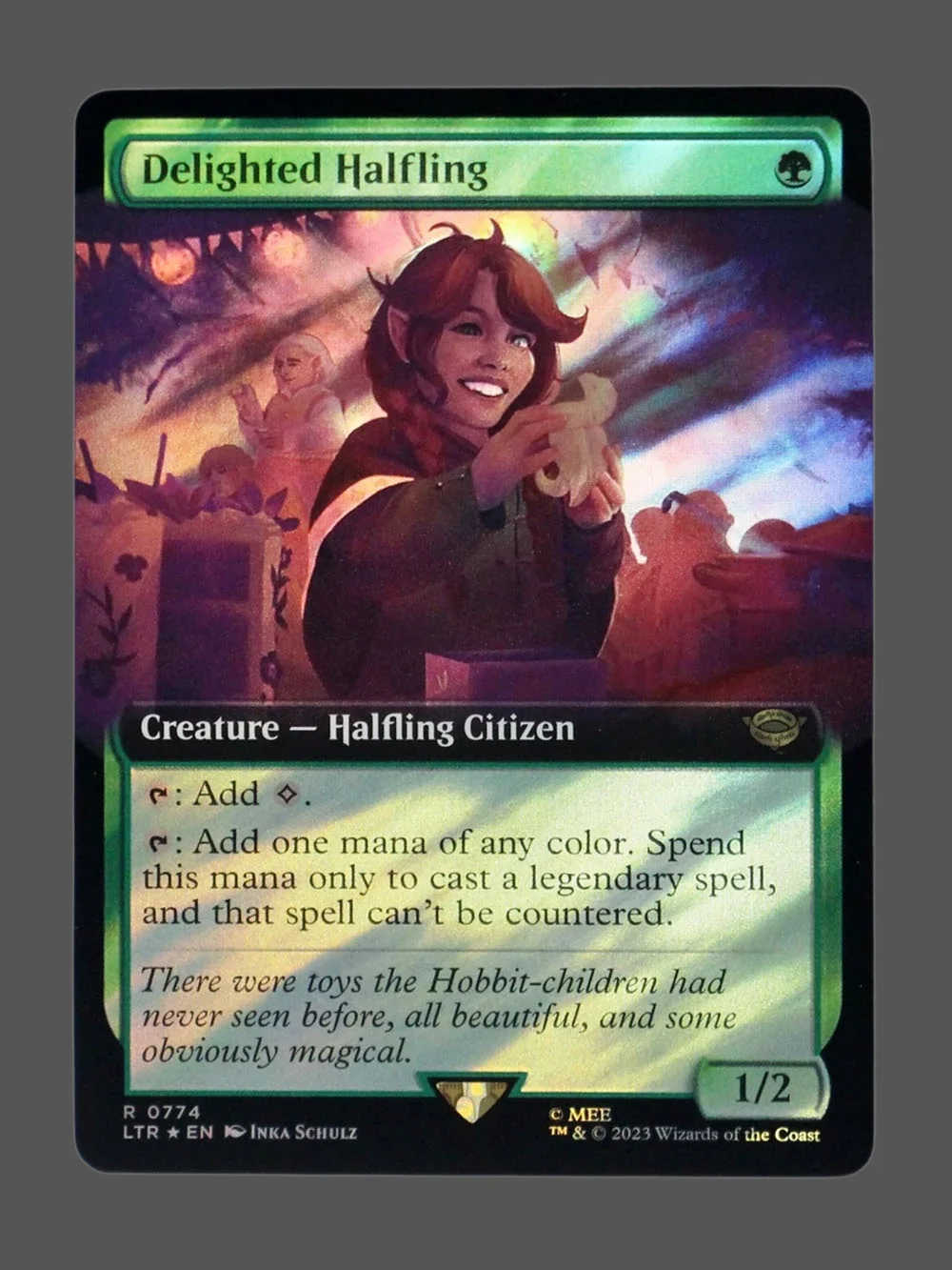 delighted-halfling-774-surgefoil.webp Delighted Halfling Surge Foil MTG proxy card from The Lord of the Rings: Tales of Middle-earth #774