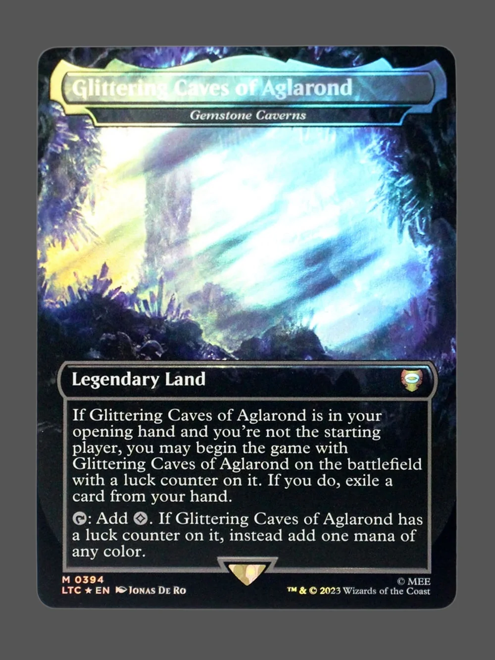 glittering-caves-of-aglarond-394-surgefoil.webp Glittering Caves of Aglarond Surge Foil MTG proxy card from Tales of Middle-earth Commander #394